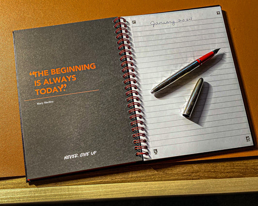 journal with silver fountain pen