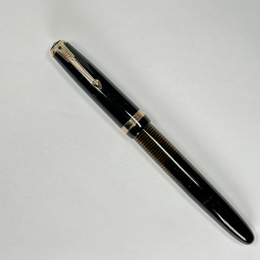 Parker Vacuumatic Debutante, Fine 14K Parker Nib, Black Fountain Pen Name/Type: Parker Vacuumatic Manufacture Year: 1939 Length: 4 5/8 Filling System: Vacuumatic with plastic plunger; restored Color/Pattern: Black with gold-filled trim great barrel transp
