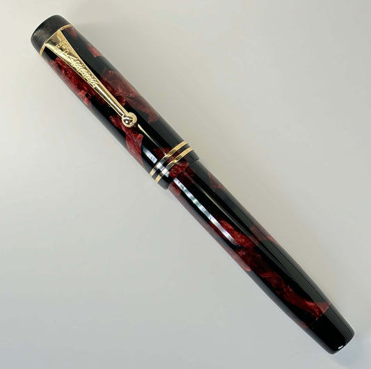 Parker Duofold, JR Streamline Fountain Pen, Burgundy and Black, Medium 14K Parker Nib Name/Type: Parker Duofold, JR, Streamline Manufacture Year: 1930s Length: 4 3/4 Filling System: Button Filler; restored with new sac. Color/Pattern: Burgundy and Black w