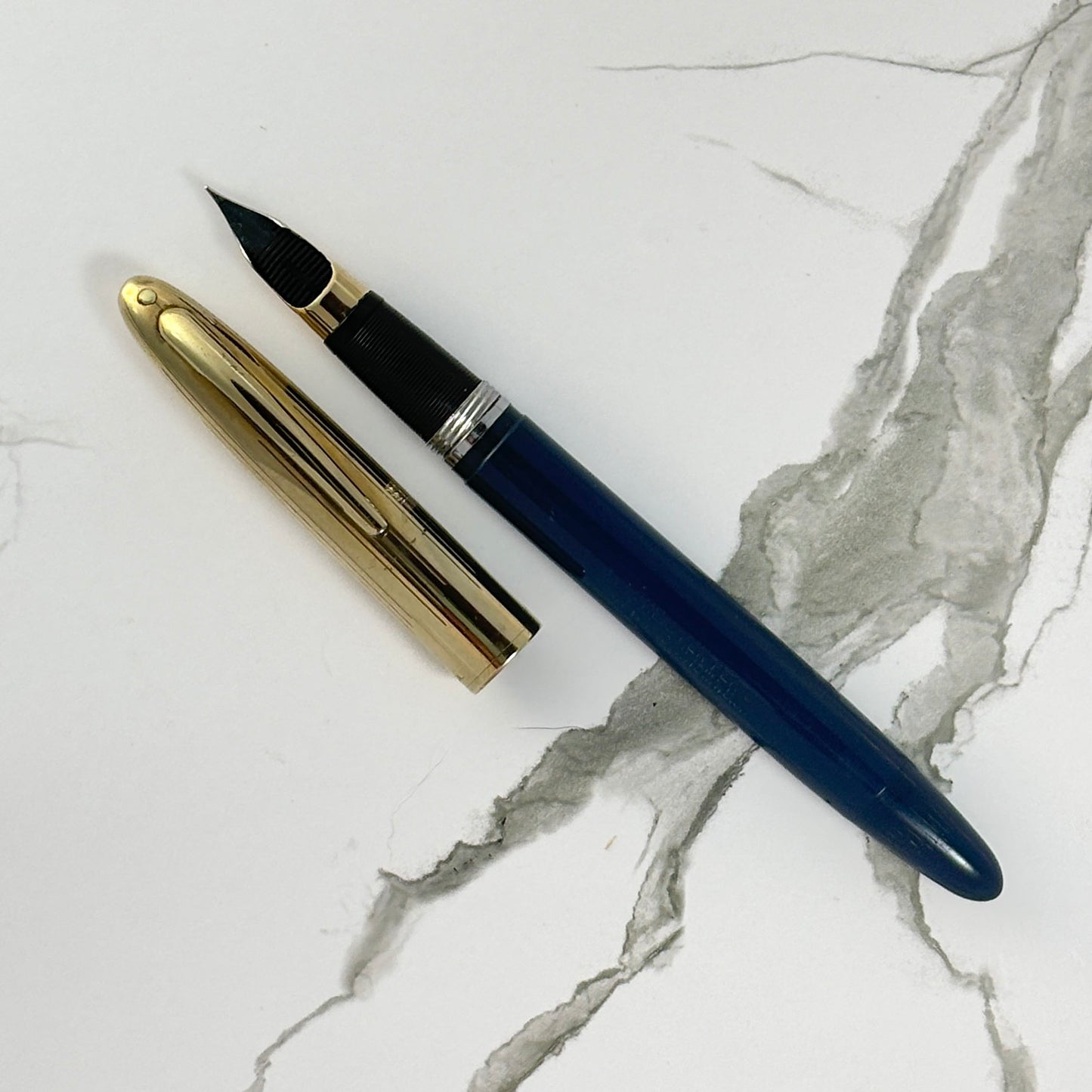 Sheaffer Touchdown TM Crest Deluxe; Persian Blue Barrel with GF Cap, Fine 14K two-tone triumph nib. Ozark Pen Shop