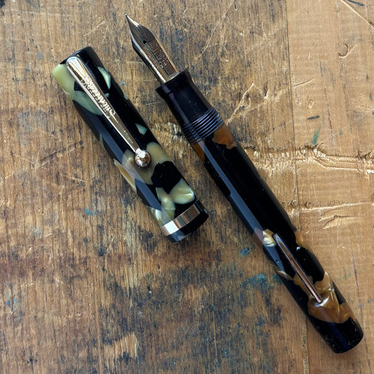 Sheaffer Flat Top Lifetime Fountain Pen, Oversized Black and PearlName/Type: Sheaffer Flat Top Lifetime Manufacture Year: 1920s Length: 5 3/8 Filling System: Restored lever filler with a new sac Color/Pattern: Black and Pearl Nib Type/Condition and remark