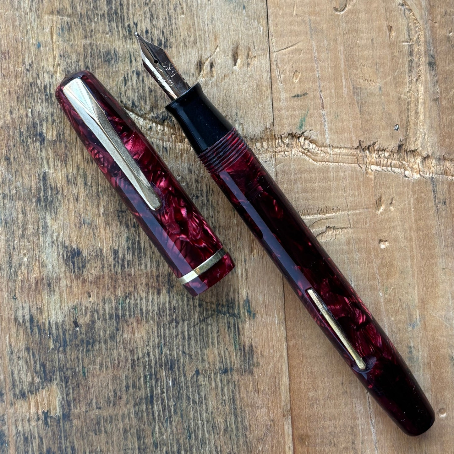 Sheaffer WASP, Lever-fil, Two-tone WASP NibName/Type: Sheaffer WASP Clipper Manufacture Year: Late 1930s Length: 5 Filling System: Lever-Fil, Restored with new seals. Color/Pattern: Red and black, gold-filled trim. Nib Type/Condition and remarks: Smooth a