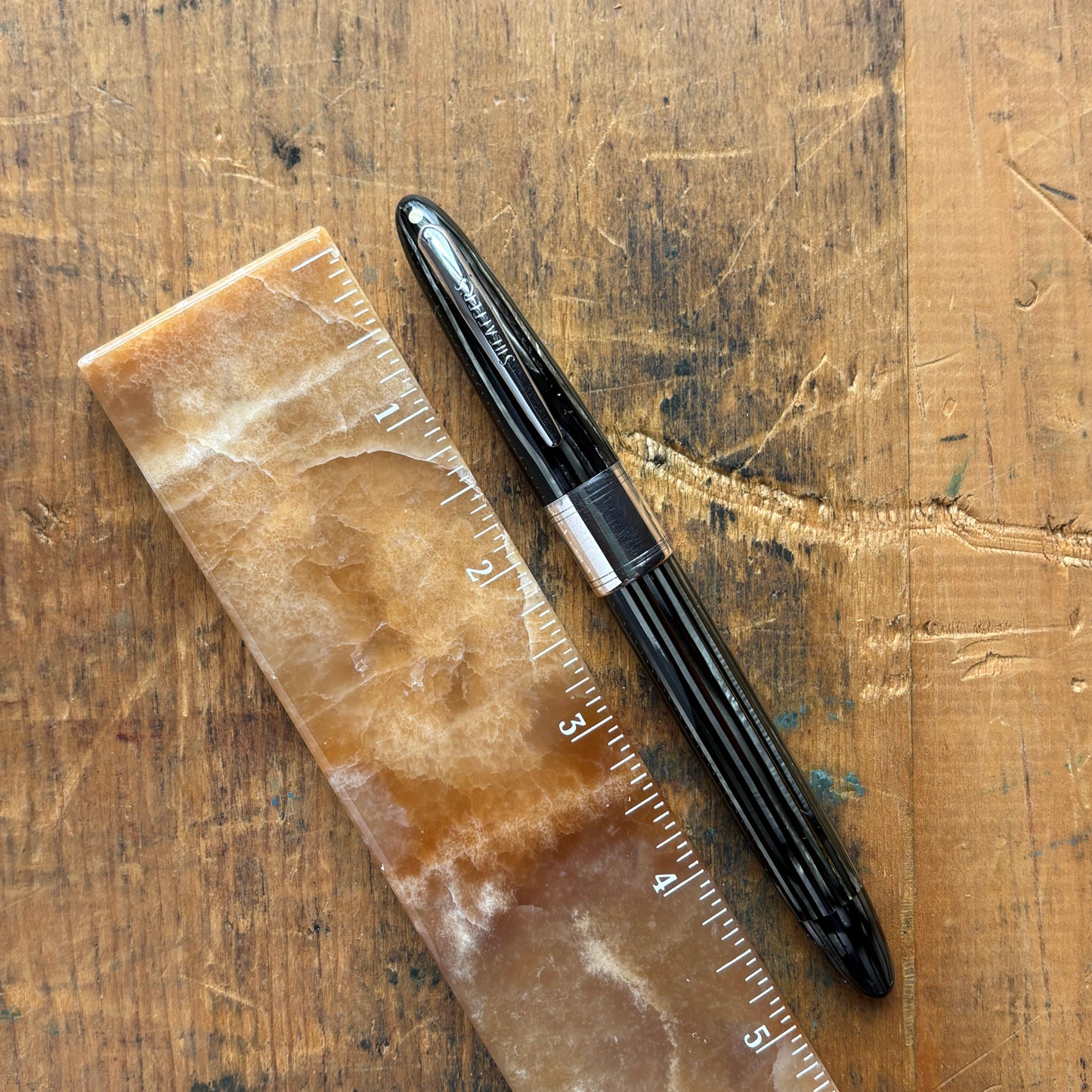 Sheaffer Triumph 1250 Lifetime Fountain Pen, Gray PearlName/Type: Sheaffer Triumph Length: 5 1/4 Filling System: Restored Vac-Fil with new seals Color/Pattern: Gray pearl barrel and cap with large chrome cap band Nib Type/Condition and remarks: Two-tone 1