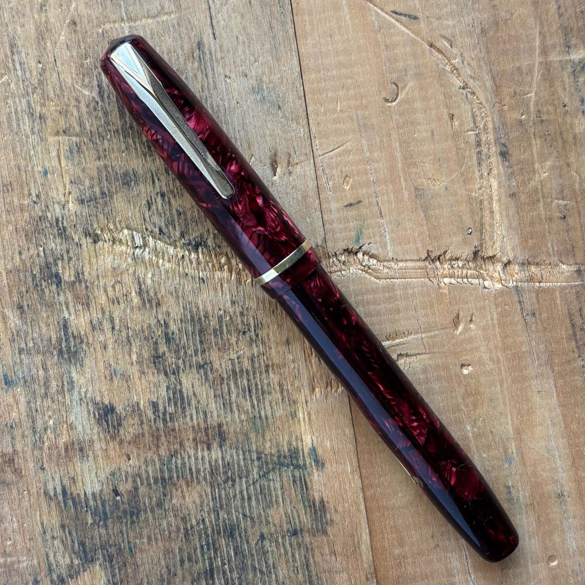 Sheaffer WASP, Lever-fil, Two-tone WASP NibName/Type: Sheaffer WASP Clipper Manufacture Year: Late 1930s Length: 5 Filling System: Lever-Fil, Restored with new seals. Color/Pattern: Red and black, gold-filled trim. Nib Type/Condition and remarks: Smooth a