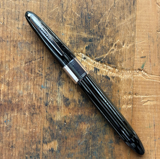 Sheaffer Triumph 1250 Lifetime Fountain Pen, Gray PearlName/Type: Sheaffer Triumph Length: 5 1/4 Filling System: Restored Vac-Fil with new seals Color/Pattern: Gray pearl barrel and cap with large chrome cap band Nib Type/Condition and remarks: Two-tone 1