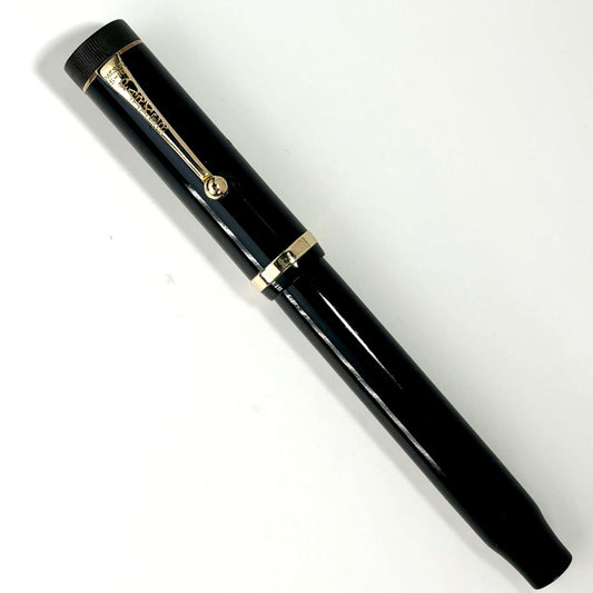 Parker SR Duofold Black Fountain Pen, Restored Button Filler, 14K Fine Nib Name/Type: Parker Duofold Manufacture Year: 1920s Length: 5 1/2 Filling System: Button Filler; Restored with new sac Color/Pattern: Black Permanite with gold plated clip and cap ba