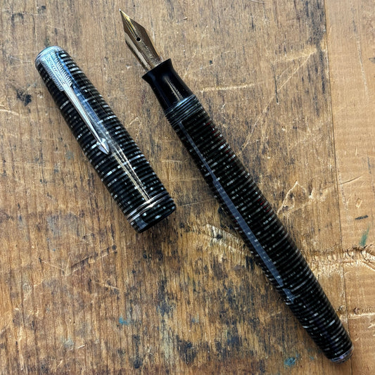 Double Jewel Parker Vacumatic; Silver PearlName/Type: Parker Vacumatic Manufacture Year: 1940 Length: 5 Filling System: Vacumatic with speed line filler Color/Pattern: Silver Pearl with Nickel Trim, two cap bands and double jeweled Nib Type/Condition and