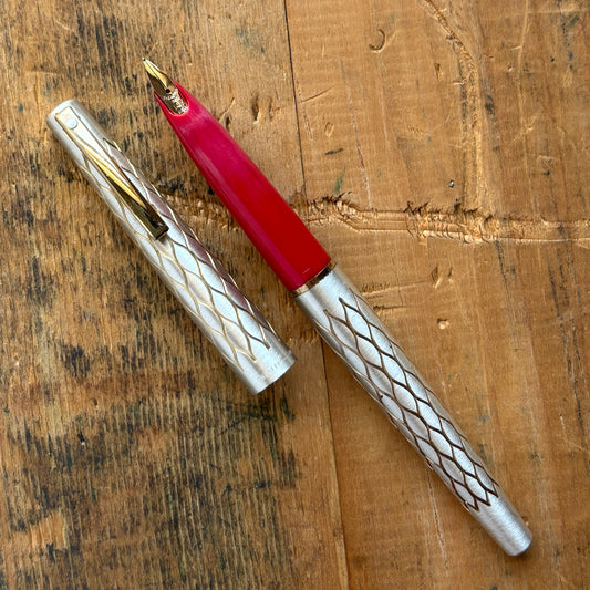 Lady Sheaffer 642-R, Satin TulleLength: 5 1/8 Filling System: Cartridge - Converter Color/Pattern: Satin Tulle with red section Nib Type/Condition and remarks: Fine 14k nib Condition: In excellent condition, still stickered and has no chips, cracks, or de