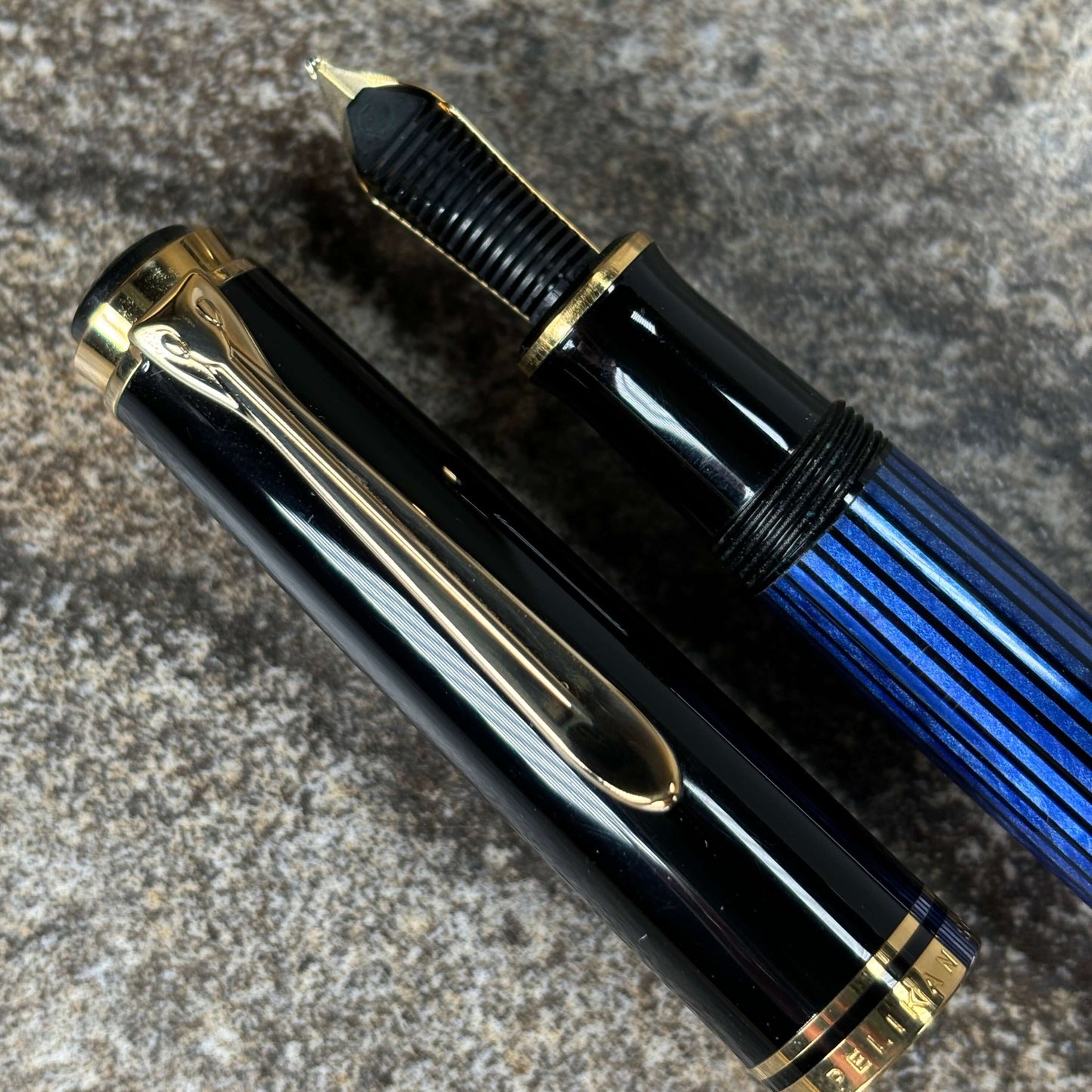 Pelikan M600 Blue/Black. Medium two tone nib, piston filler. Ozark Pen Shop