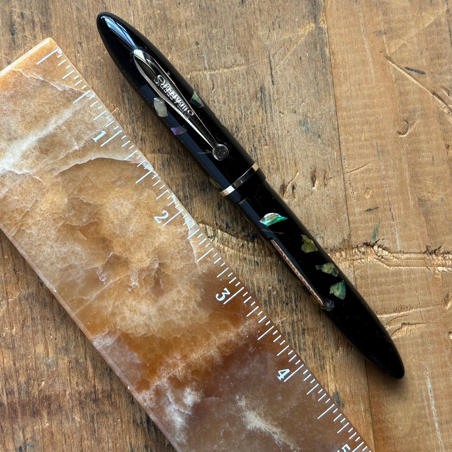 Sheaffer Balance, Ebonized Pearl, Lever FillerName/Type: Sheaffer Balance Manufacture Year: Mid 1930s Length: 4 7/8 Filling System: Lever filler; restored with new sac Color/Pattern: Ebonized Pearl with gold-filled trim Nib Type/Condition and remarks: Smo