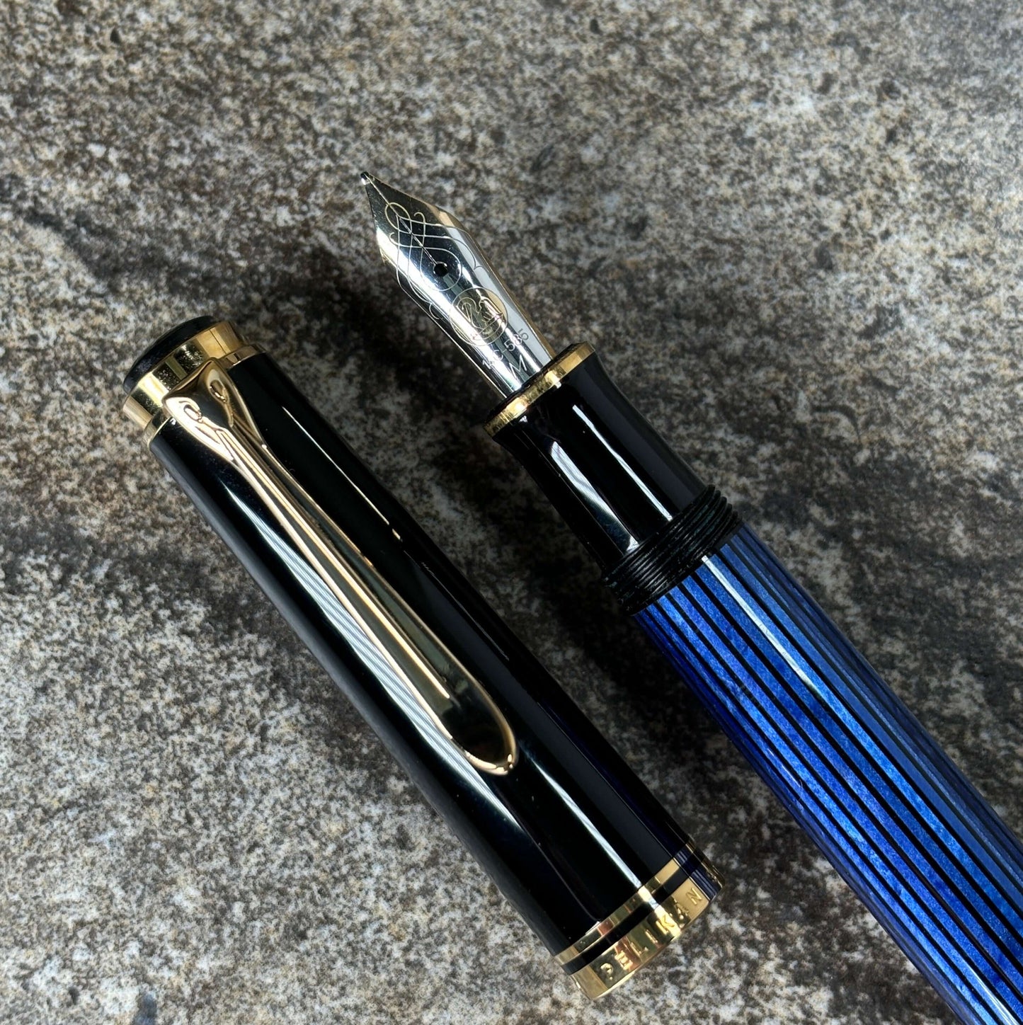 Pelikan M600 Blue/Black. Medium two tone nib, piston filler. Ozark Pen Shop