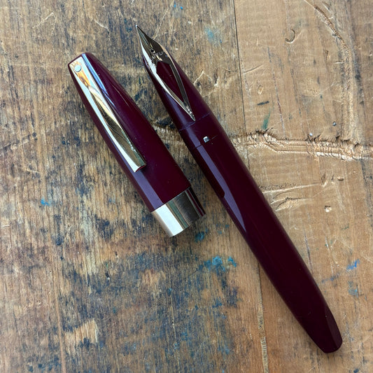Sheaffer PFM III, Fully Restored, Burgundy with 14K Inlaid Medium NibName/Type: Sheaffer PFM III Manufacture Year: 1959-1968 Length: 5 3/8 Filling System: Snorkel Filler, restored with new sac and seals Color/Pattern: Burgundy with gold-filled clip and ca