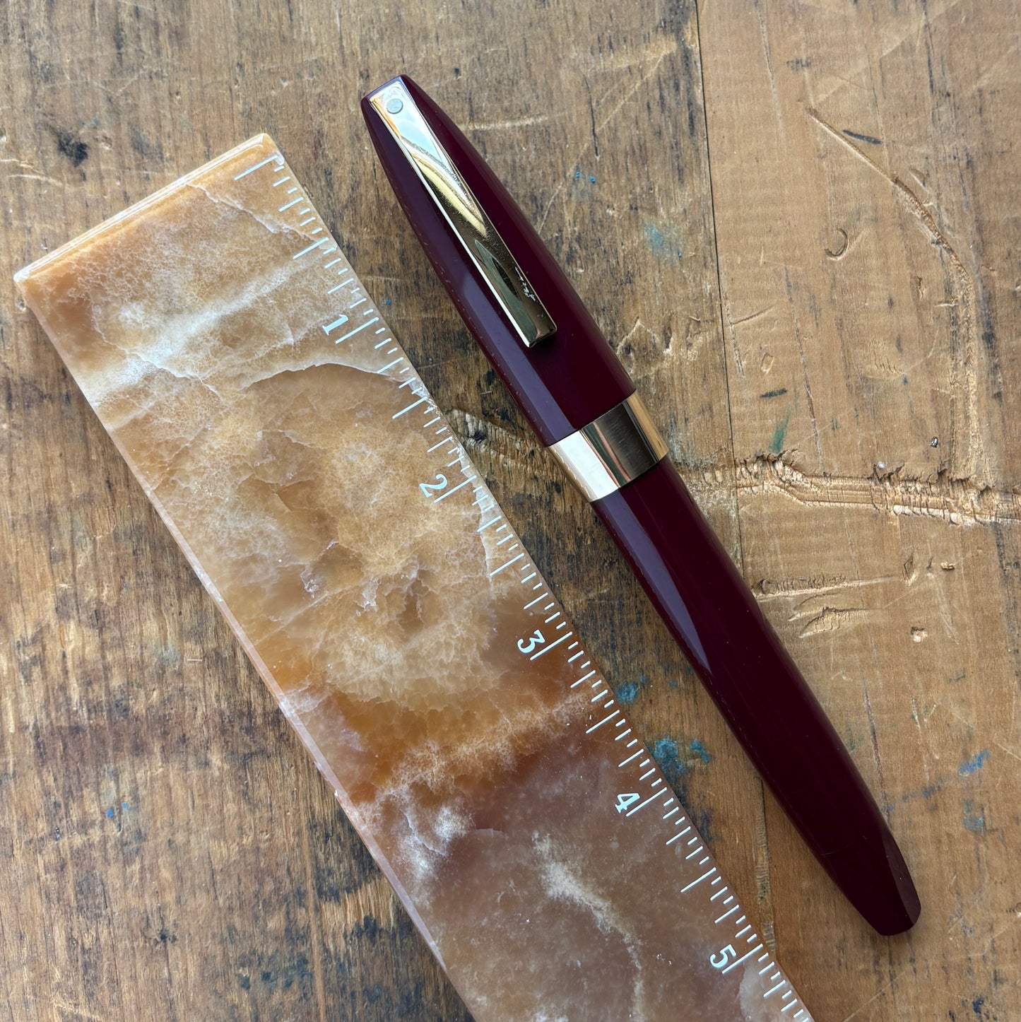 Sheaffer PFM III, Fully Restored, Burgundy with 14K Inlaid Medium NibName/Type: Sheaffer PFM III Manufacture Year: 1959-1968 Length: 5 3/8 Filling System: Snorkel Filler, restored with new sac and seals Color/Pattern: Burgundy with gold-filled clip and ca