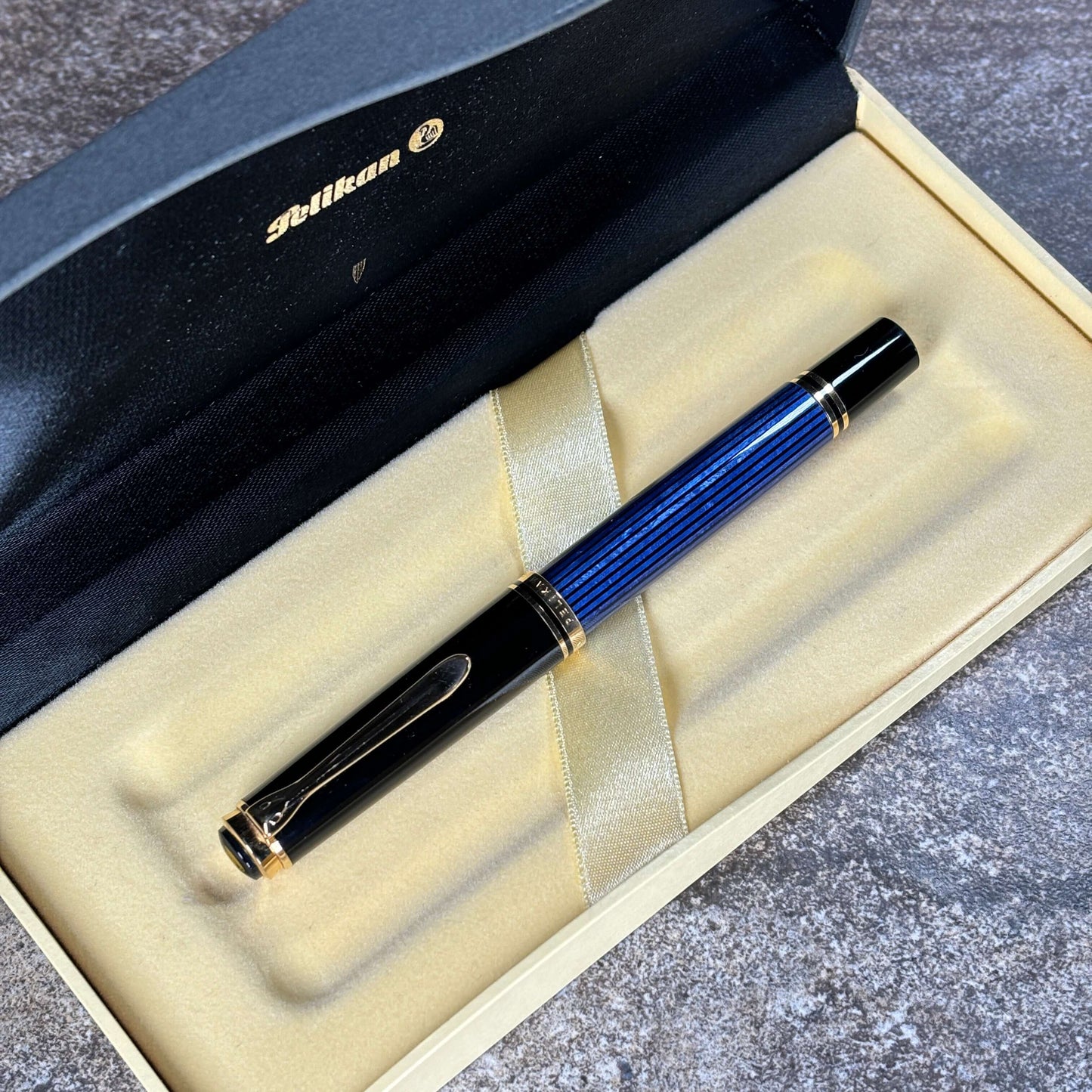 Pelikan M600 Blue/Black. Medium two tone nib, piston filler. Ozark Pen Shop