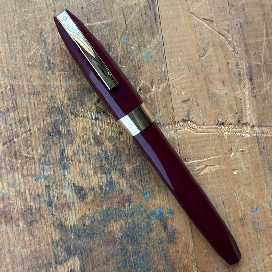 Sheaffer PFM III, Fully Restored, Burgundy with 14K Inlaid Medium NibName/Type: Sheaffer PFM III Manufacture Year: 1959-1968 Length: 5 3/8 Filling System: Snorkel Filler, restored with new sac and seals Color/Pattern: Burgundy with gold-filled clip and ca