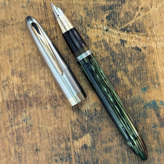 Sheaffer Sentinel Deluxe Restored Fountain PenName/Type: Sheaffer Sentinel Deluxe vac-fil Manufacture Year: 1947 Length: 5 Filling System: Restored Vac-fill with new seals. Color/Pattern: Marine Green with a two-tone cap. Nib Type/Condition and remarks: L