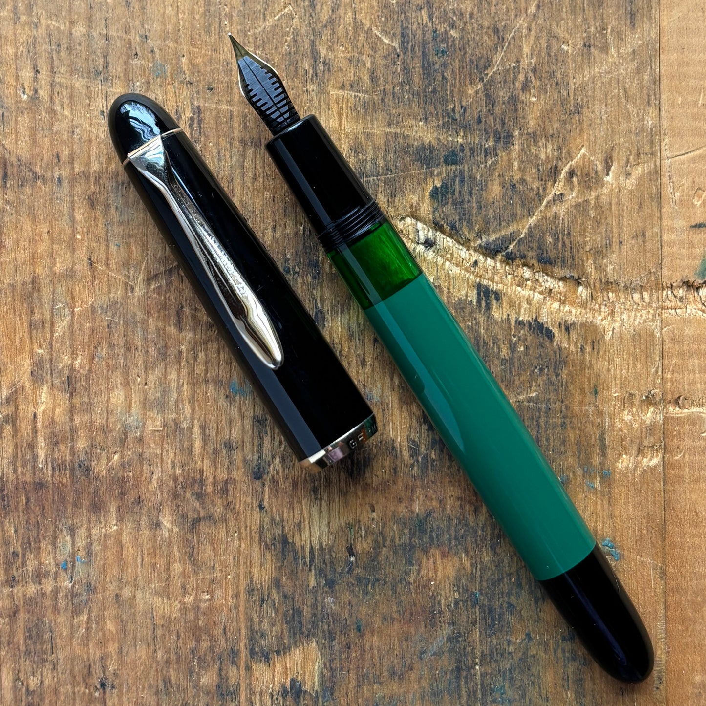 Pelikan 120 Green/Black. Medium Flexy Steel nibName/Type: Pelikan 120 Length: 5 1/8 Filling System: Piston Filler Color/Pattern: Green/Black Nib Type/Condition and Remarks: Flexy steel, medium nib The pen is in very good condition, and the plating on the