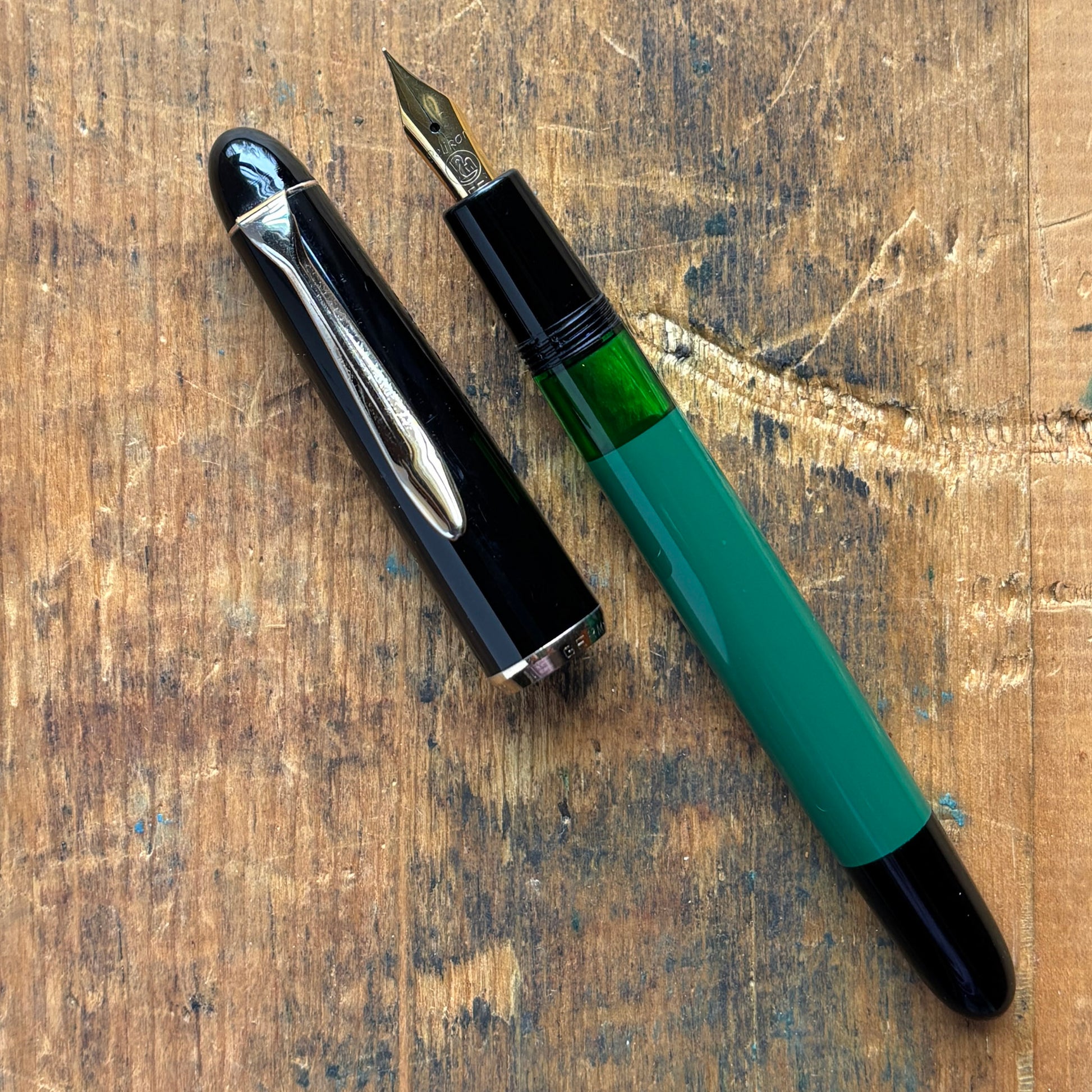 Pelikan 120 Green/Black. Medium Flexy Steel nibName/Type: Pelikan 120 Length: 5 1/8 Filling System: Piston Filler Color/Pattern: Green/Black Nib Type/Condition and Remarks: Flexy steel, medium nib The pen is in very good condition, and the plating on the