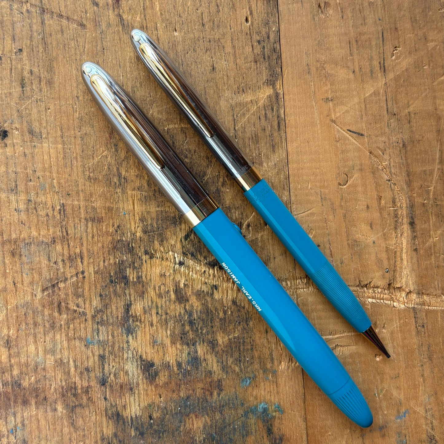 Sheaffer Sentinel Snorkel Fountain Pen/Pencil SetName/Type: Sheaffer Sentinel Manufacture Year: 1950s Length: 5 1/2 Filling System: Snorkel filler Color/Pattern: Hard to find color, Peacock Blue barrels with beautiful two-tone caps. Nib Type/Condition and