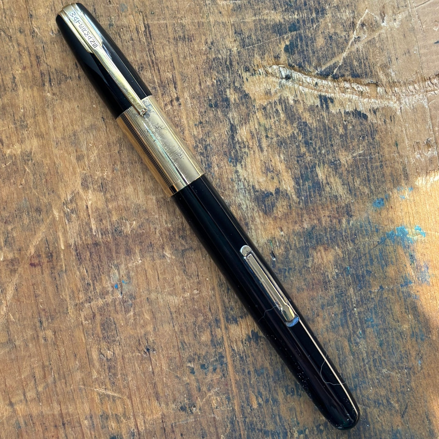 Waterman Taperite Citation, Black with Gold Filled TrimName/Type: Waterman Taperite Manufacture Year: 1940s Length: 5 1/4 Filling System: Lever Filler Color/Pattern: Black with Gold Filled Trim Nib Type/Condition and remarks: Medium 14K Nib; Fairly respon