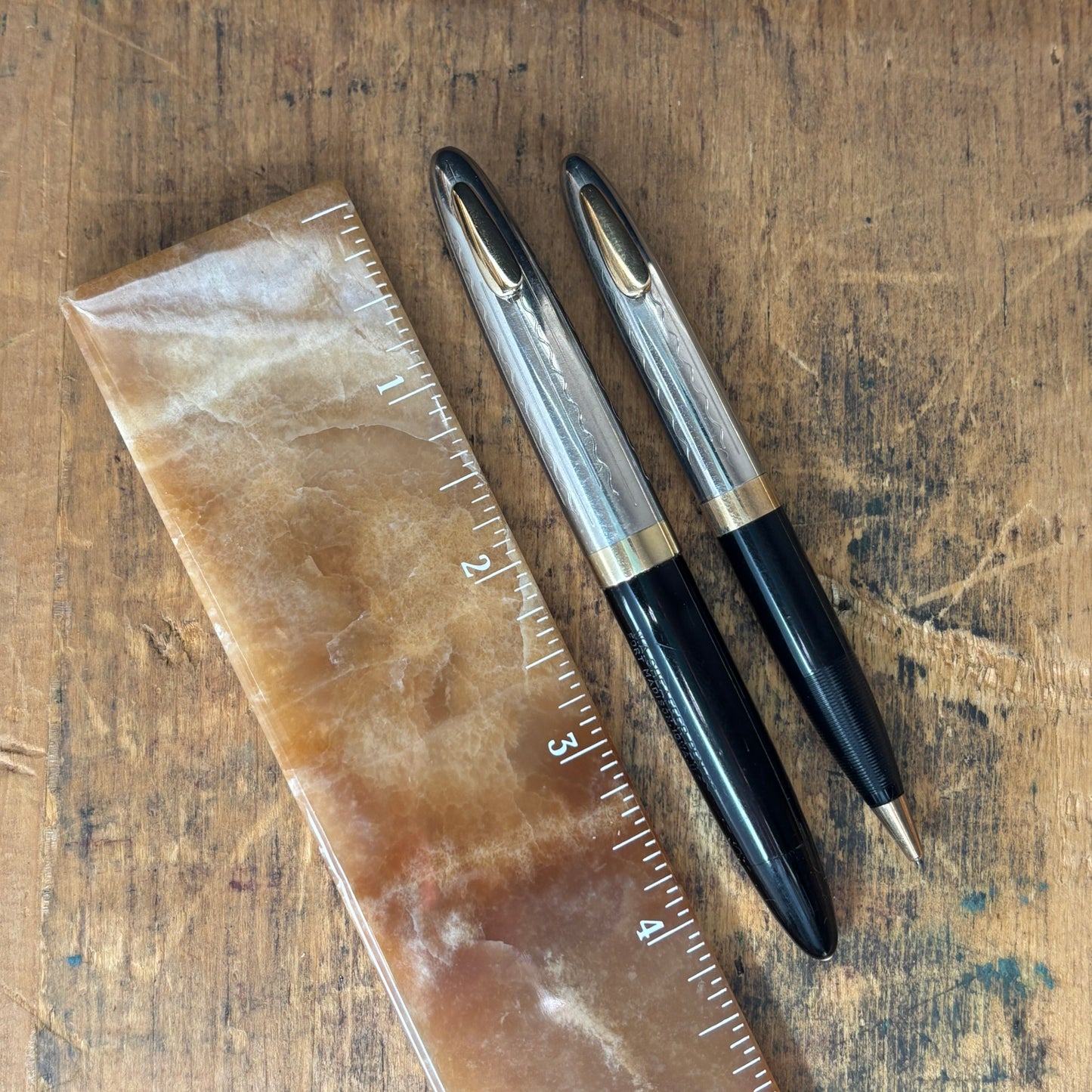 Sheaffer Tuckaway Sentinel Pen/Pencil Set, BlackName/Type: Sheaffer Tuckaway Manufacture Year: 1940s Length: 4 1/2 Filling System: Restored Vacuum fil Color/Pattern: Black with two-tone cap Nib Type/Condition and Remarks: Fine two-tone nib Condition: Exce