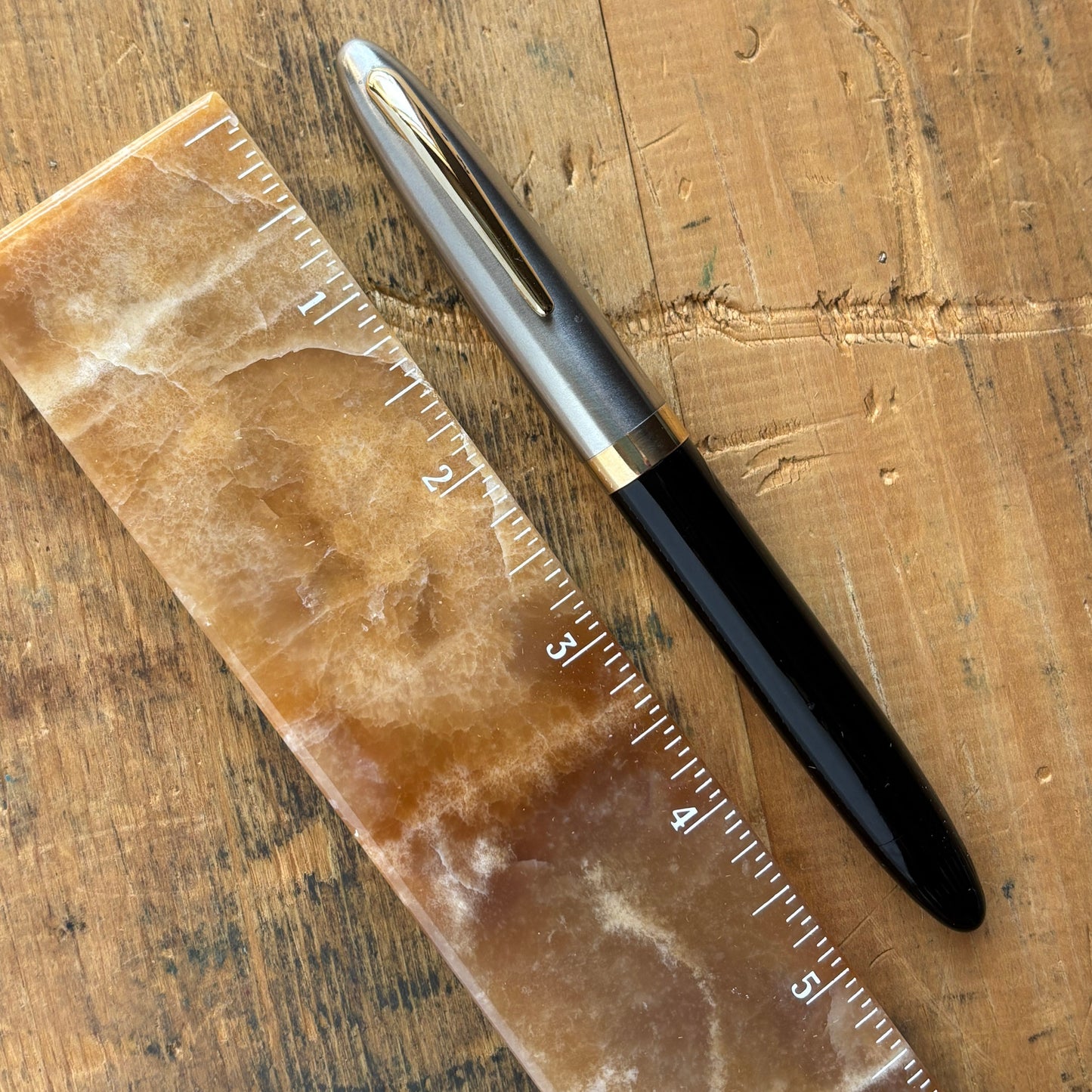 Sheaffer Sentinel Deluxe 1250 Restored Fountain PenName/Type: Sheaffer Sentinel Deluxe vac-fil Manufacture Year: 1947 Length: 5 1/4 Filling System: Restored Vac-fill with new seals. Color/Pattern: Black with a two-tone cap. Nib Type/Condition and remarks: