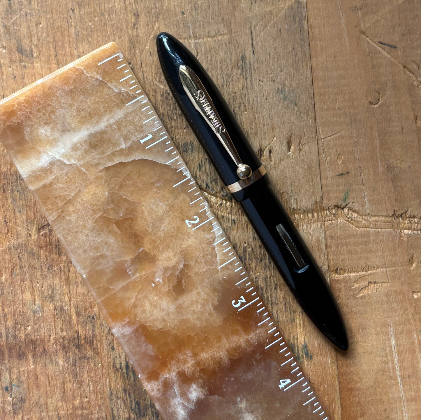 Sheaffer Petit Balance, Restored Lever-fillerName/Type: Sheaffer Petit Balance Manufacture Year: 1930s Length: 4 1/8 Filling System: Restored Lever Filler Color/Pattern: Black with gold-filled trim Nib Type/Condition and remarks: 14K medium nib marked She