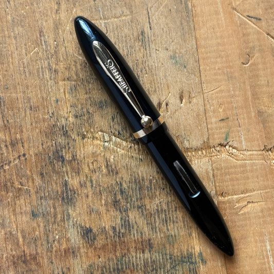 Sheaffer Petit Balance, Restored Lever-fillerName/Type: Sheaffer Petit Balance Manufacture Year: 1930s Length: 4 1/8 Filling System: Restored Lever Filler Color/Pattern: Black with gold-filled trim Nib Type/Condition and remarks: 14K medium nib marked She