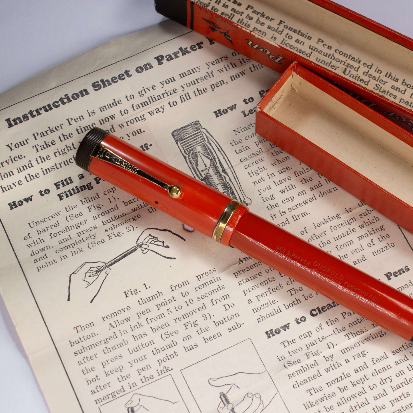 Parker Duofold Senior, Red Hard Rubber, Raised Cap Band, Button Fill, Large 14K Gold Duofold nib. Comes in original box with instruction sheet. Ozark Pen Shop