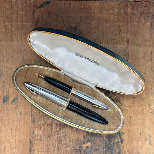 Sheaffer Tuckaway Sentinel Pen/Pencil Set, BlackName/Type: Sheaffer Tuckaway Manufacture Year: 1940s Length: 4 1/2 Filling System: Restored Vacuum fil Color/Pattern: Black with two-tone cap Nib Type/Condition and Remarks: Fine two-tone nib Condition: Exce