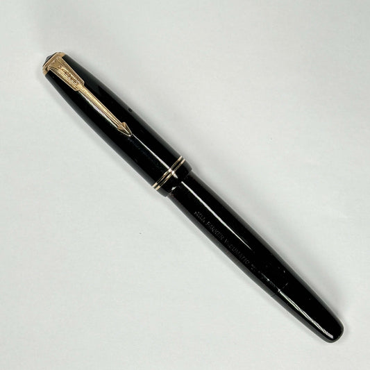Black Parker Vacumatic Pen. Restored Vac-filler Name/Type: Parker Vacuumatic Manufacture Year: 1930s Length: 5 Filling System: Restored vacumatic with plastic plunger. Color/Pattern: Black laminated with gold filled trim Nib Type/Condition and remarks: Fi
