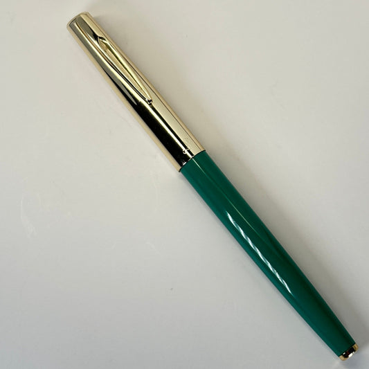 Sailor Fountain Pen; Green Barrel with Gold Cap Name/Type: Sailor Manufacture Year: Early 1960s Length: 5 1/4 Filling System: Aerometric Color/Pattern: Green barrel, Gold plated Cap Nib Type/Condition and remarks: Fine nib. Good condition