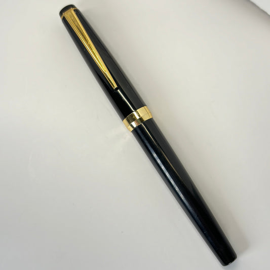 Pilot Fountain Pen, Black with Gold Plated Trim Name/Type: Pilot Manufacture Year: 1990 Length: 5 1/4 Filling System: Aerometric Color/Pattern: Black with gold plated trim. Nib Type/Condition and remarks: Fine This Pilot is in good condition, no chips, de