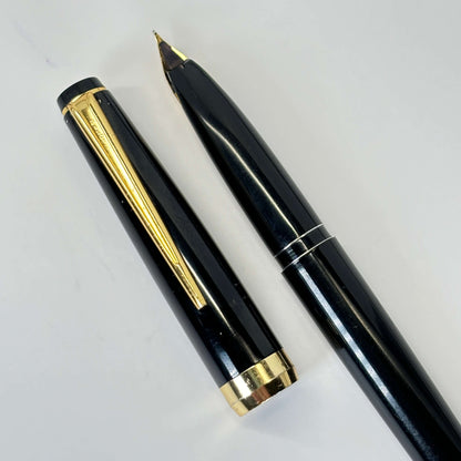 Pilot Fountain Pen, Black with Gold Plated Trim Name/Type: Pilot Manufacture Year: 1990 Length: 5 1/4 Filling System: Aerometric Color/Pattern: Black with gold plated trim. Nib Type/Condition and remarks: Fine This Pilot is in good condition, no chips, de
