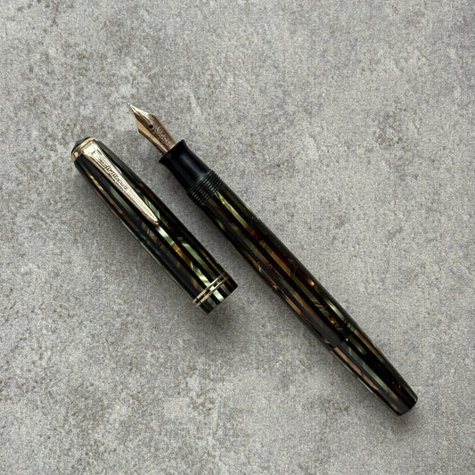 Fountain pen on a gray concrete surface