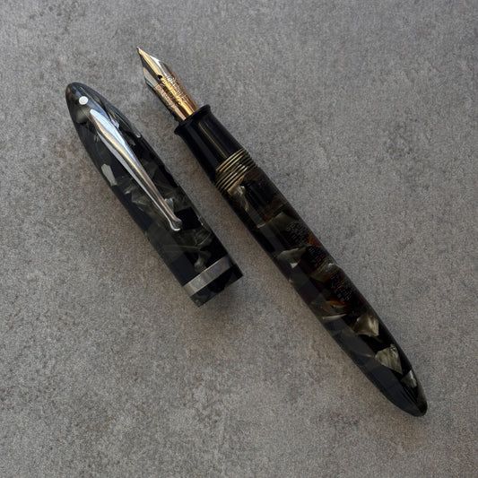 Fountain pen on a gray surface