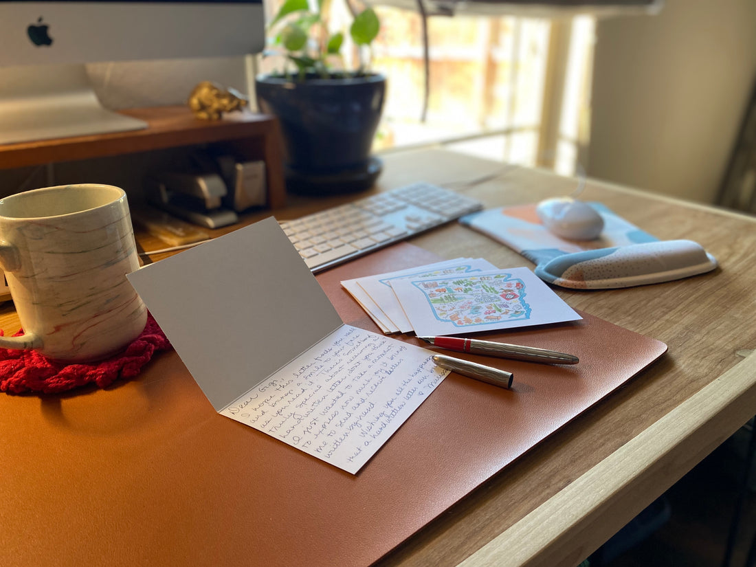 picture of a desk with a handwritten letter and fountain pen 