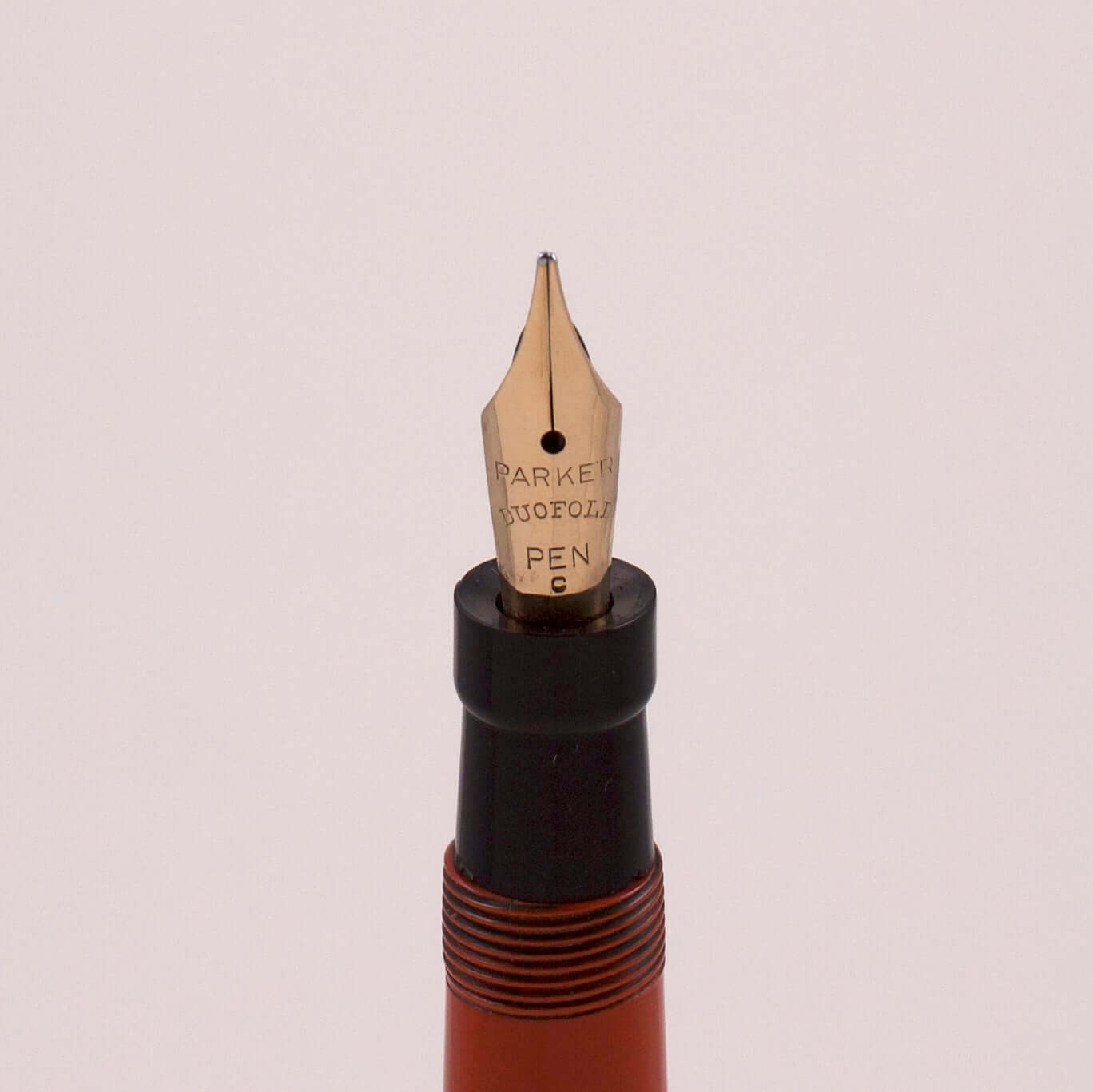 Parker Lady Duofold Ring Top. Orange Permanite with button filler. Restored. Medium 14K nib. Type: Button Fill Fountain Pen Product Name: Parker Lady Duofold Manufacture Year: 1930's Length: 4 1/2 inch Filling System: Button Filler; Restored with new sac.