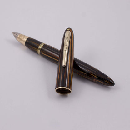 Sheaffer Vac-Fil, Brown Striated with a 14K Gold Two-tone Fine Nib, White Dot, Lifetime Product Name: Sheaffer Triumph Sovereign II Fountain Pen Manufacture Year: Mid 1940's Length: 4 7/8 Filling System: Vac-Fil, restored to working condition with new sea