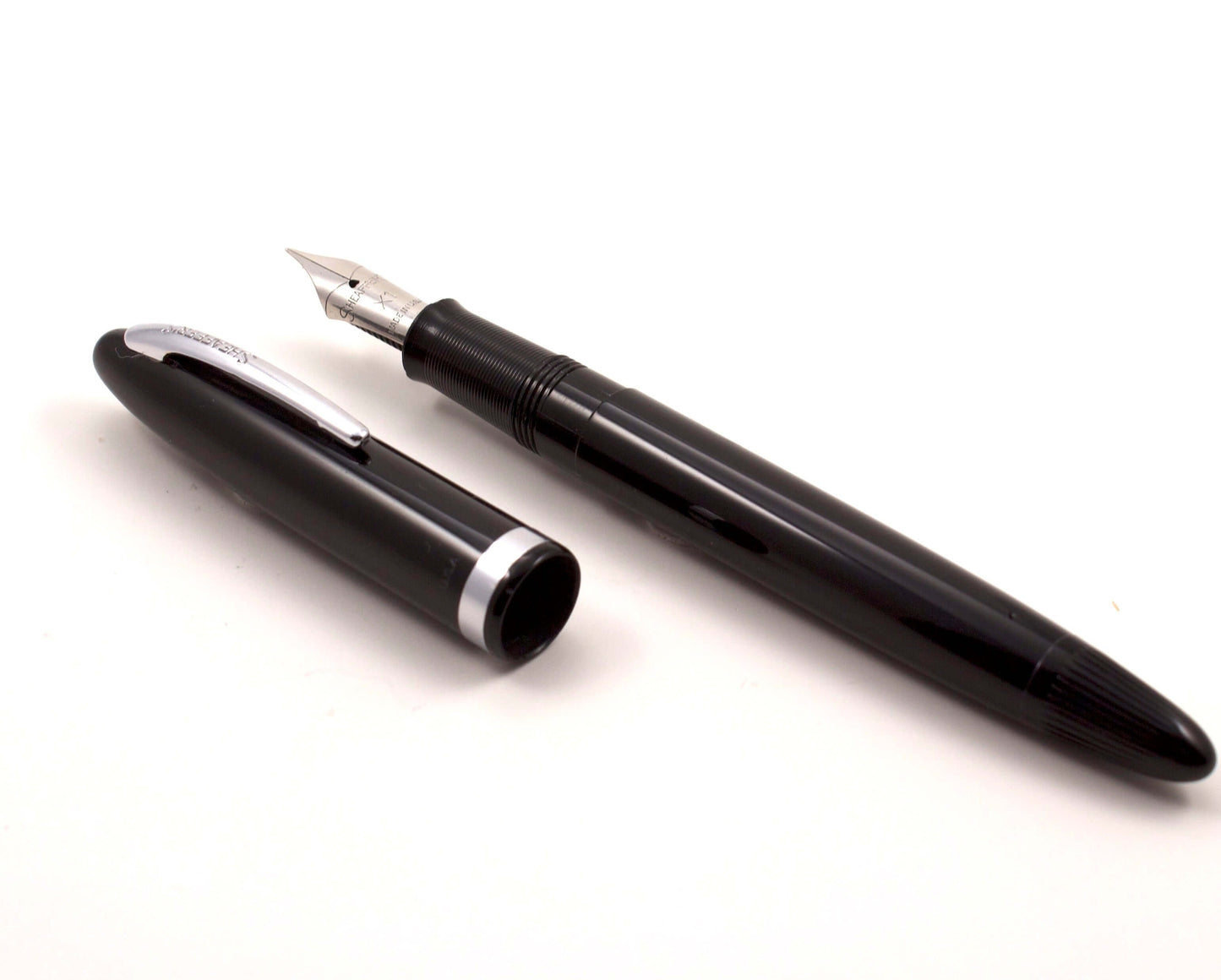 Sheaffer Tip-Dip Touchdown, Black, 1950's Stainless Nib, X1 Extra Fine Type: Sheaffer Tip Dip Fountain Pen Manufacture Year: 1950's Length: 5 1/8 Filling System: Touchdown; Restored with new sac and O-ring Color/Pattern: Black Nib Type/Condition and remar