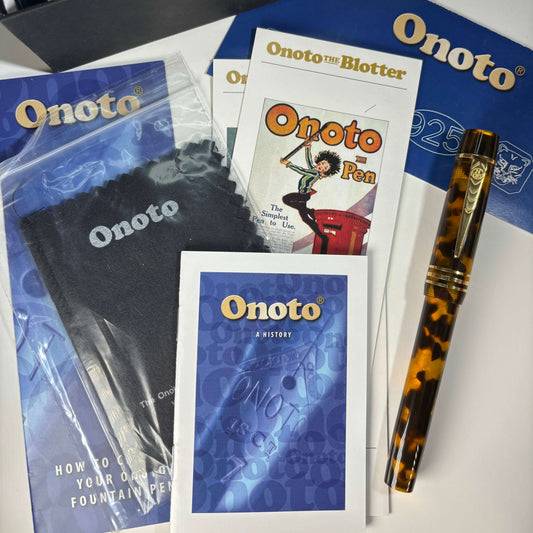 ONOTO Magna Classic, Tortoise Shell, Number 42 of 100 Manufactured Name/Type: ONOTO Magna Manufacture Year: 2013 Length: 5 1/2 Filling System: Cartridge/Converter Color/Pattern: Tortoiseshell acrylic with gold plated sterling silver clip and cap bands Nib