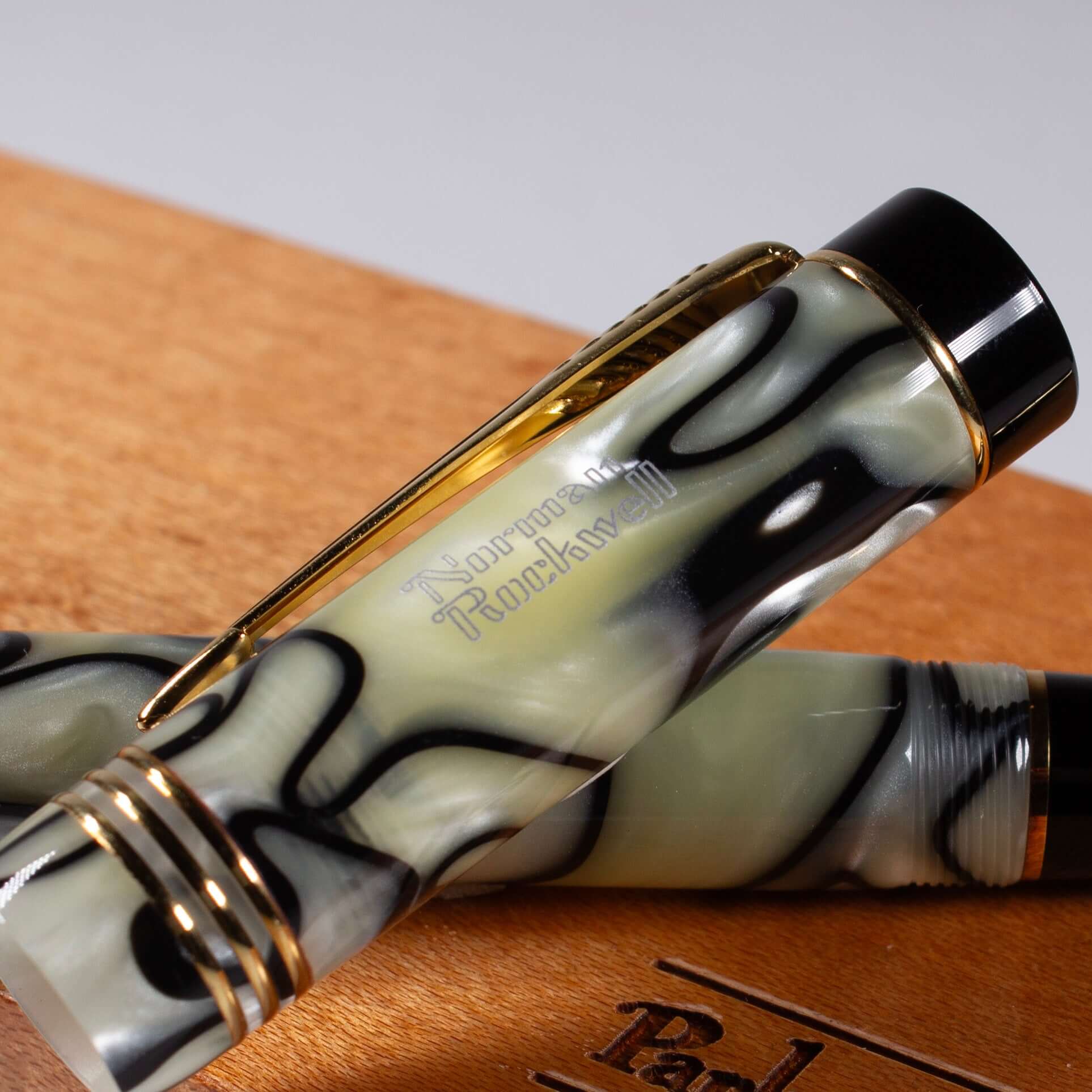 Parker Duofold Norman Rockwell Limited Edition Black and Pearl Fountain Pen, 18K Medium nib. This Parker Duofold Norman Rockwell Limited Edition Fountain Pen is number 1306 of only 3,500 produced. It features a black and pearl swirl pattern only used for