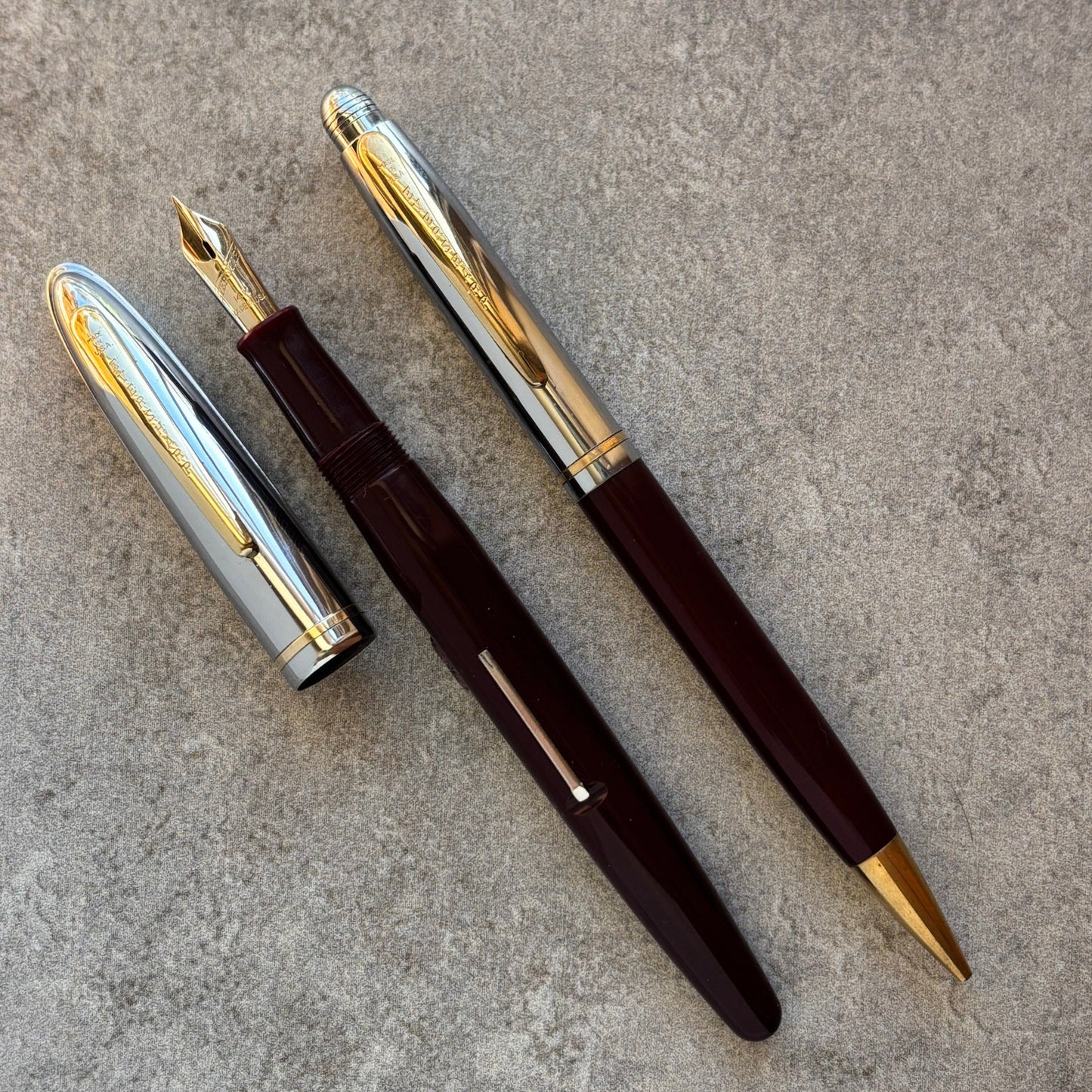 Fountain pen with gold accents on a gray surface