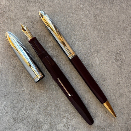 Fountain pen with gold accents on a gray surface