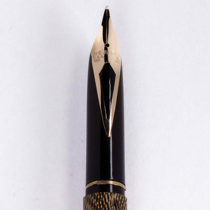 ${titleName/Type: Sheaffer Slim Targa Manufacture Year: 1980s Length: 5 3/8 Filling System: It takes Slim Sheaffer-style cartridges or converters. The original squeeze converter is included. Color/Pattern: Brass and lacquer finish in a feather pattern. Ni