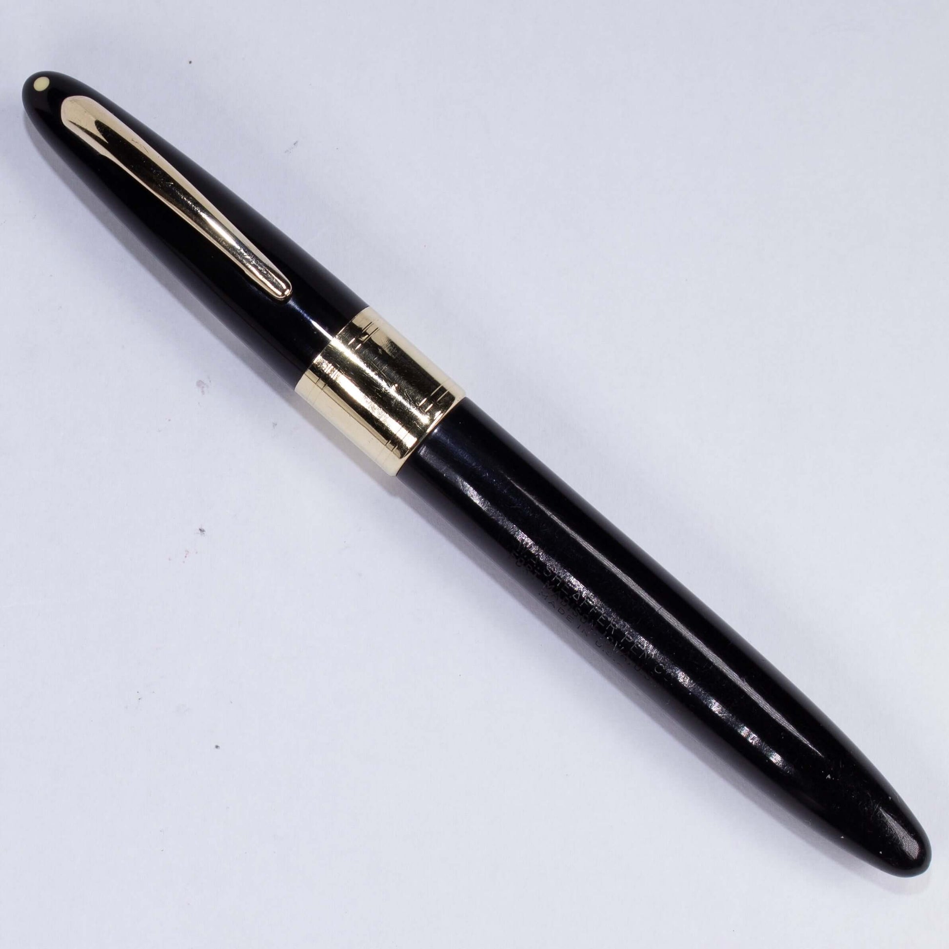 ${titleName/Type: Restored Vintage Fountain Pen Manufacture Year: 1940s Length: 5 1/4 Filling System: Lever filler with new sac Color/Pattern: Black Nib Type/Condition and remarks: Large Two-toned wraparound Triumph 14K fine nib Condition: ﻿This large She