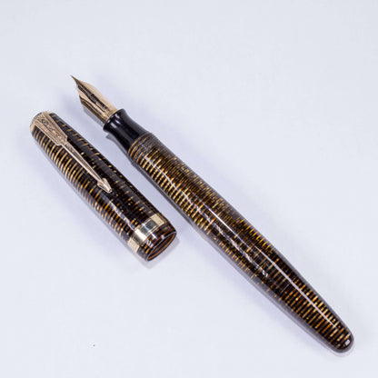 Parker Vacumatic Debutante Vintage Fountain Pen, Golden Pearl, 14K Fine Nib.Name/Type: Parker Vacumatic Debutante Fountain Pen, 14K Fine Nib Manufacture Year: 1944 Length: 4 7/8 Filling System: Restored Vacumatic with plastic plunger Color/Pattern: Golden