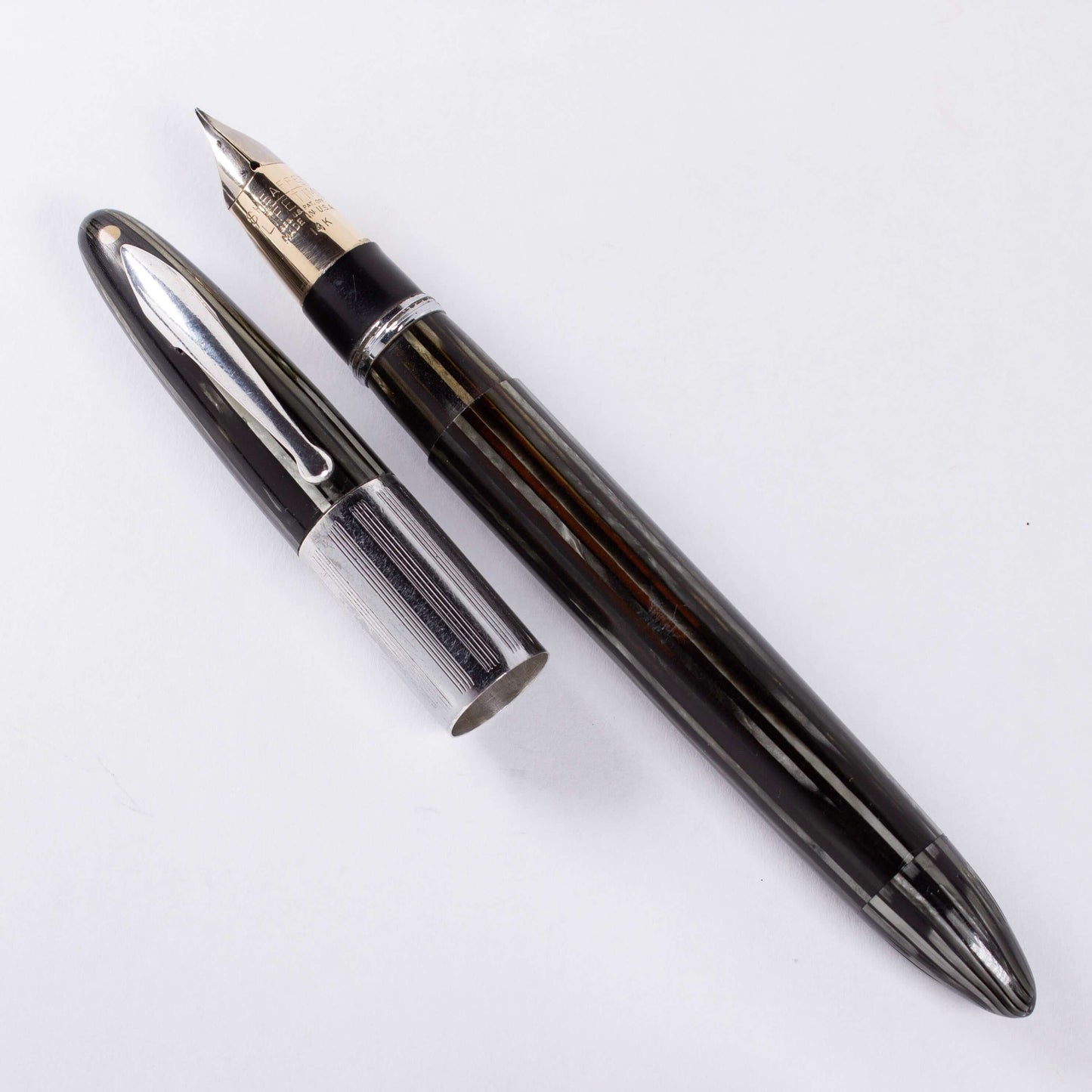 ${titleType: Vintage Vac-Fil Fountain Pen Product name: Sheaffer Triumph Vacuum-Fil Manufacturer and Year: 1940's Length: 5 1/8 inch Filling System: Vacuum-Fil, Plunger, restored with new section and piston Color/Pattern: Grey Pearl Nib Type/Condition and