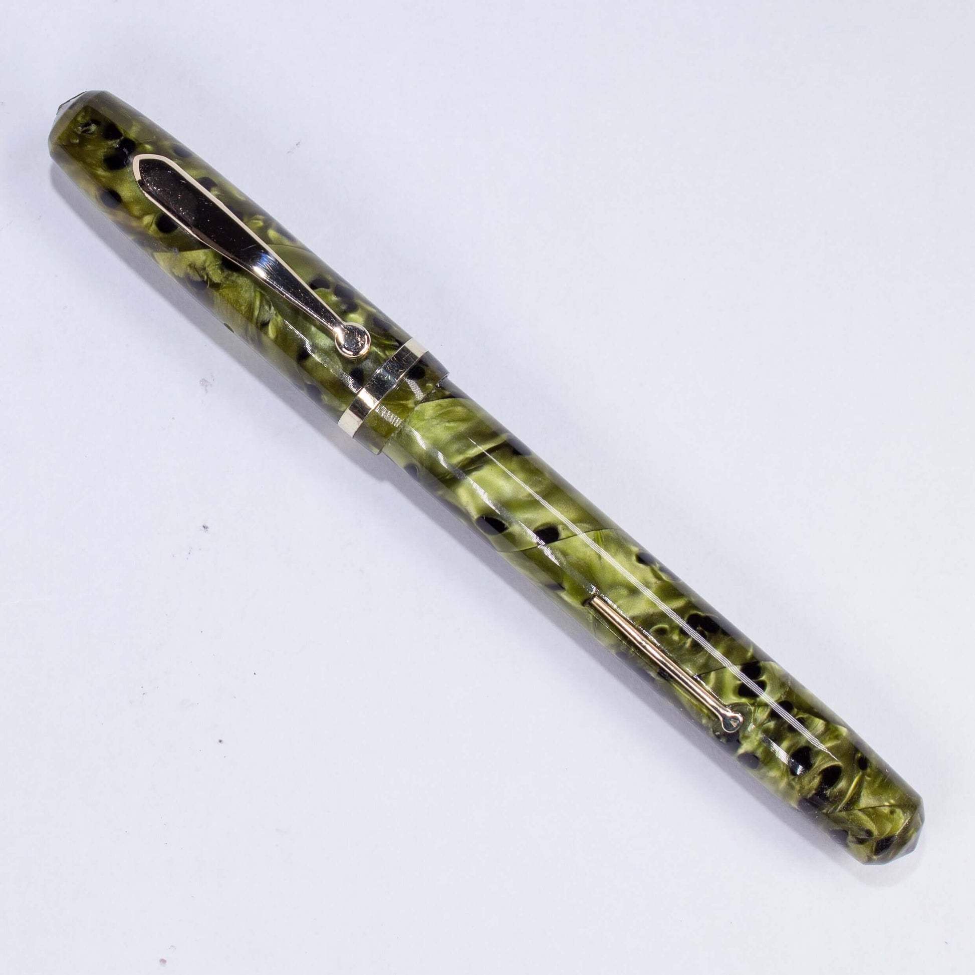 ${titleName/Type: Restored WASP Vacuum-fil Fountain Pen Manufacture Year: Circa 1930s Length: 5 Filling System: Lever Filler Color/Pattern: Green Birdseye, some refer to this color as Screaming Souls in Purgatory. Nib Type/Condition and remarks: 12K Gold
