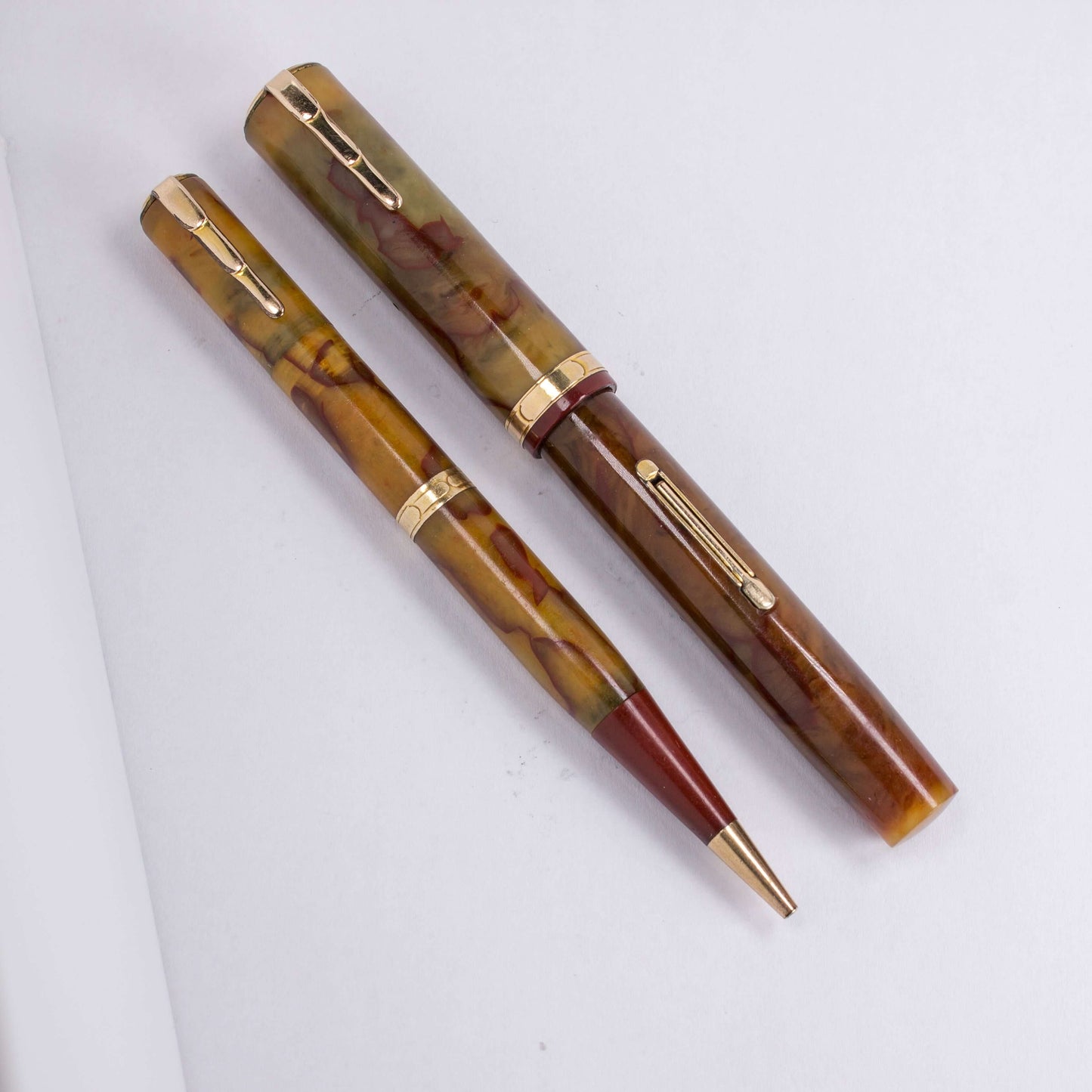 ${titleType: Waterman's Lady PatriciaManufacture Year: 1930'sLength: 4 5/16Filling System: Lever filler, restored with new sacColor/Pattern: Onyx, Cream with red veinsNib Type/Condition and remarks: Fine Accountant, Firm, Waterman's IdealCondition: Excell